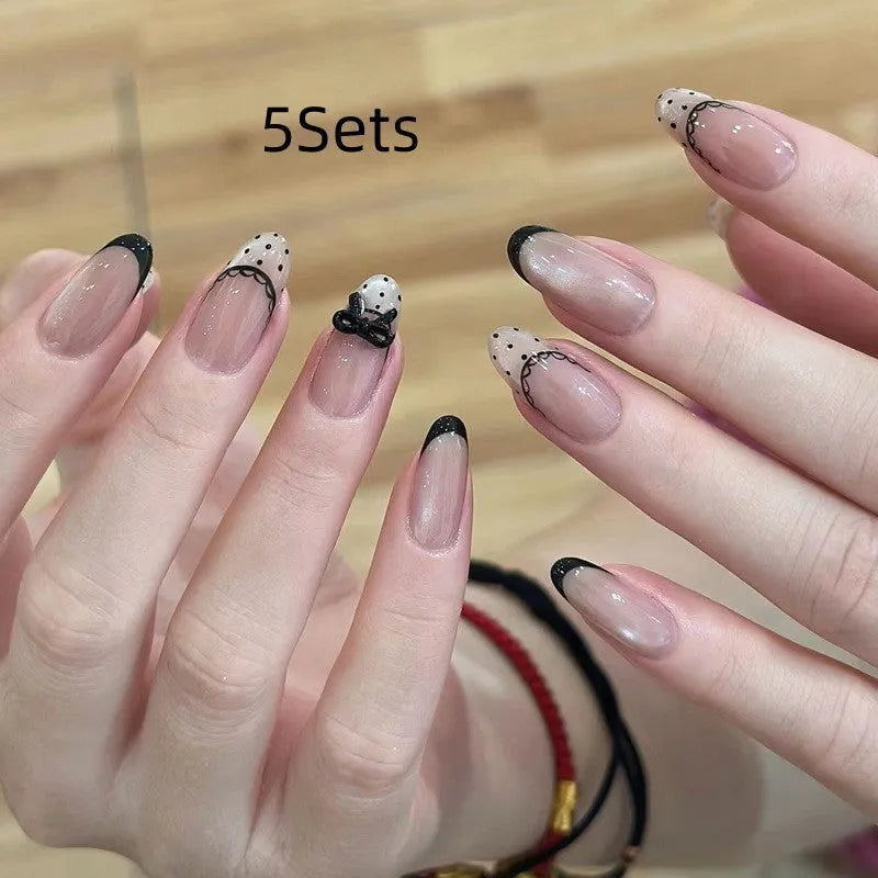 Set of colourful press-on false nails for girls with adhesive tabs on a white background.