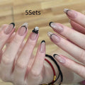 Set of colourful press-on false nails for girls with adhesive tabs on a white background.