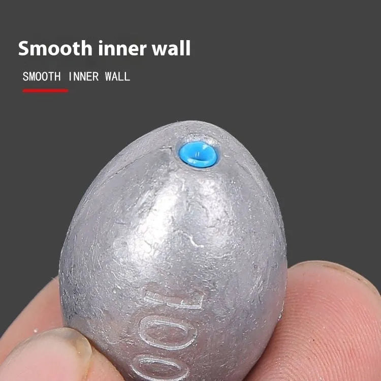 Plastic core olive fishing sinker with rugby shape and scale markings for sea fishing