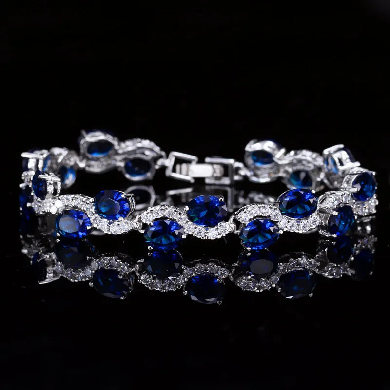 Copper gold plated bracelet with AAA+ zircon stones showing geometric design and 18.4 cm length