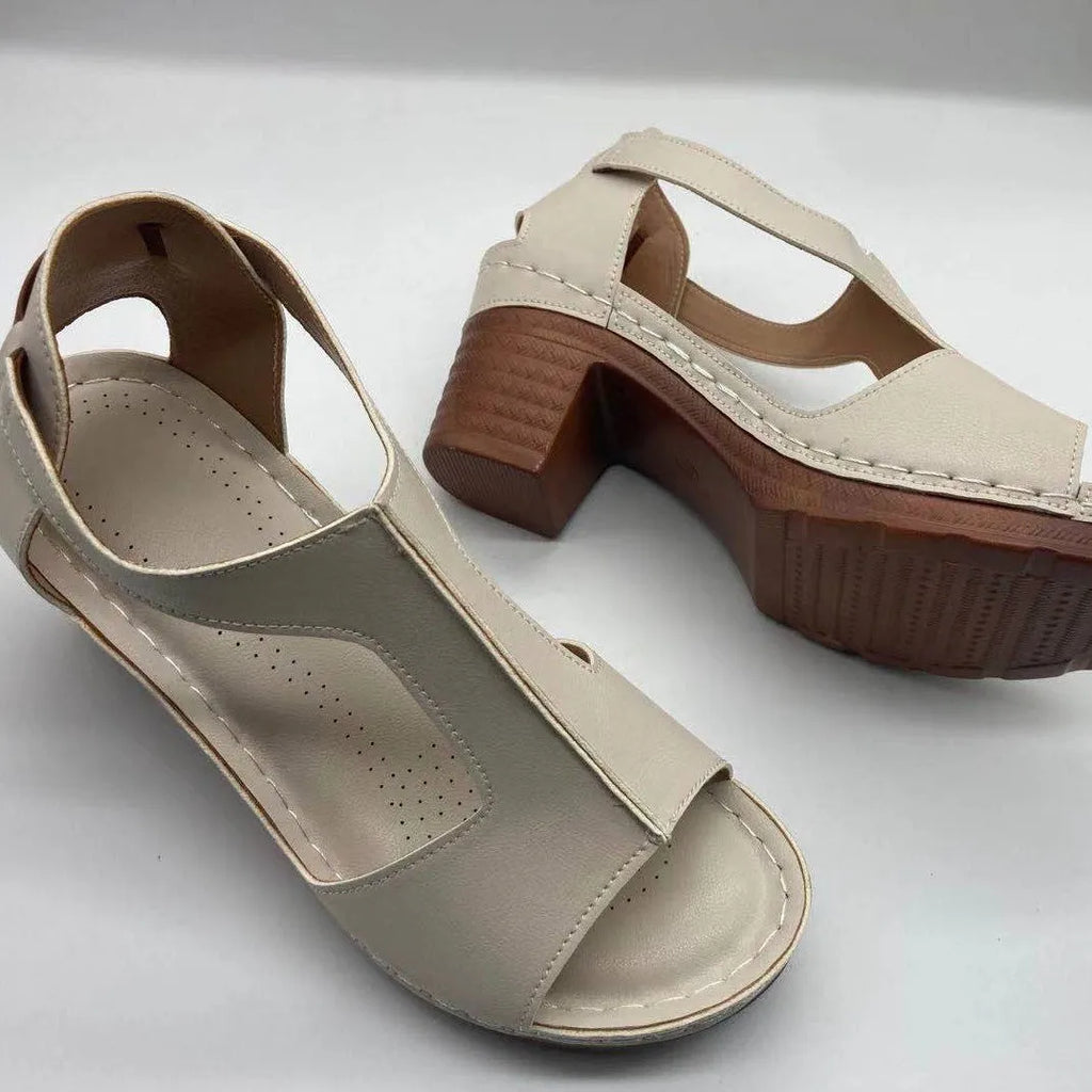 Women's peep toe wedge sandals with a buckle strap, shown in a light brown colour on a white background.