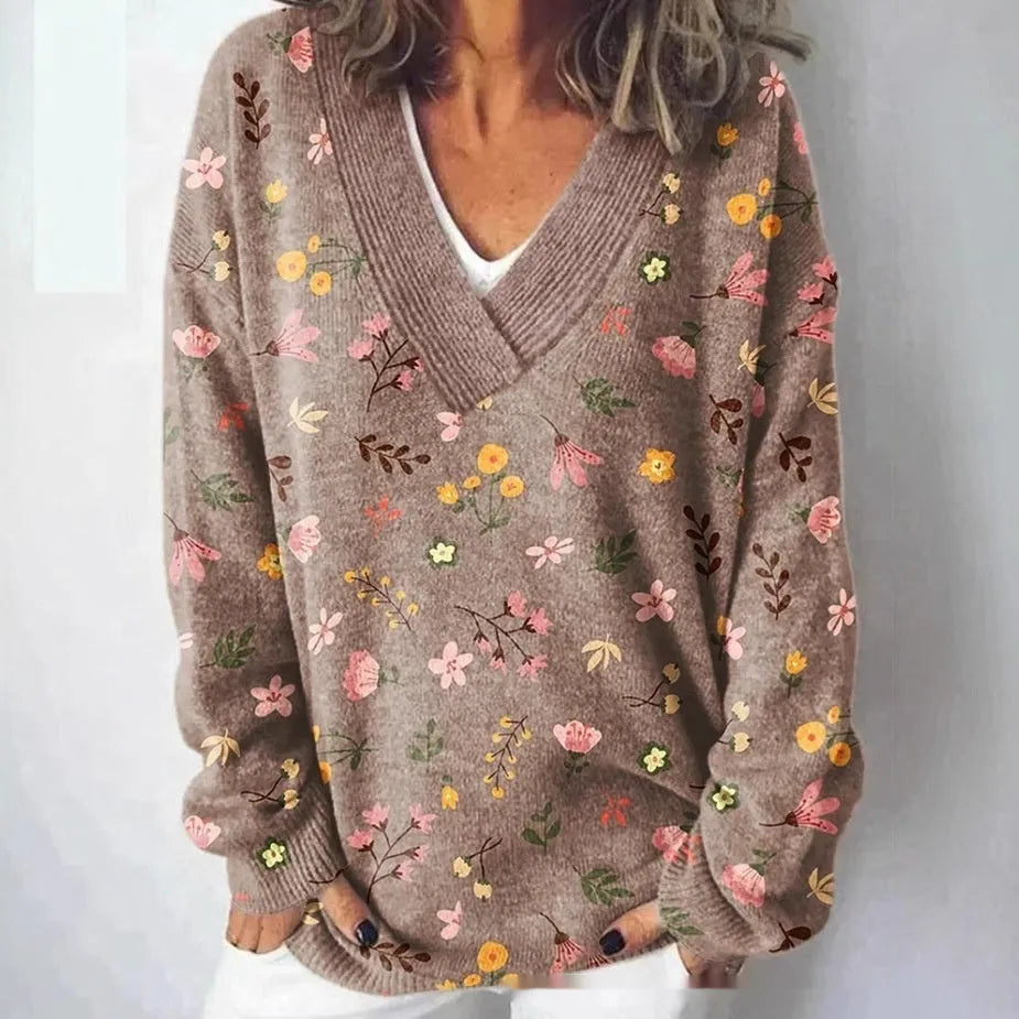 Women's V-neck long sleeve sweatshirt with a blue and white 3D floral print pattern.