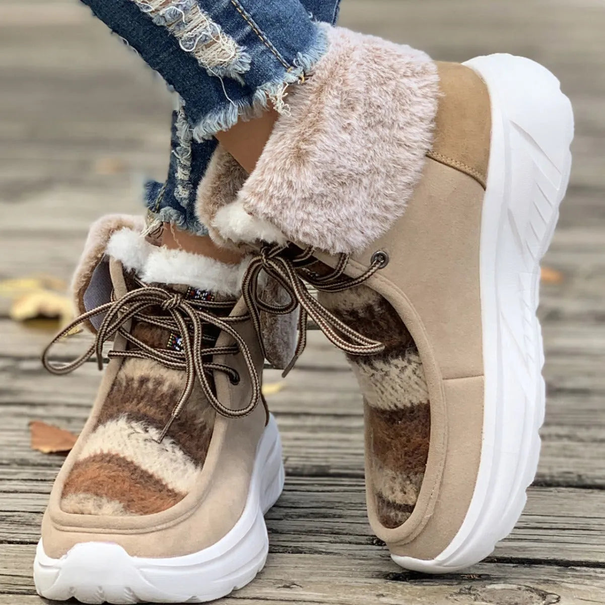Women's lace-up snow boots with suede upper, plush lining, and platform sole