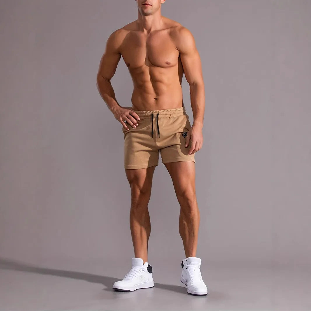 Men's khaki coconut print sports shorts with straight cut design and micro elastic polyester fabric