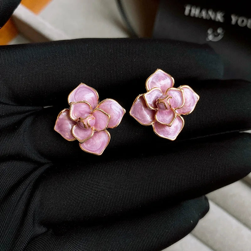 Gold plated purple oil-spot glaze flower stud earrings on copper with fresh floral design
