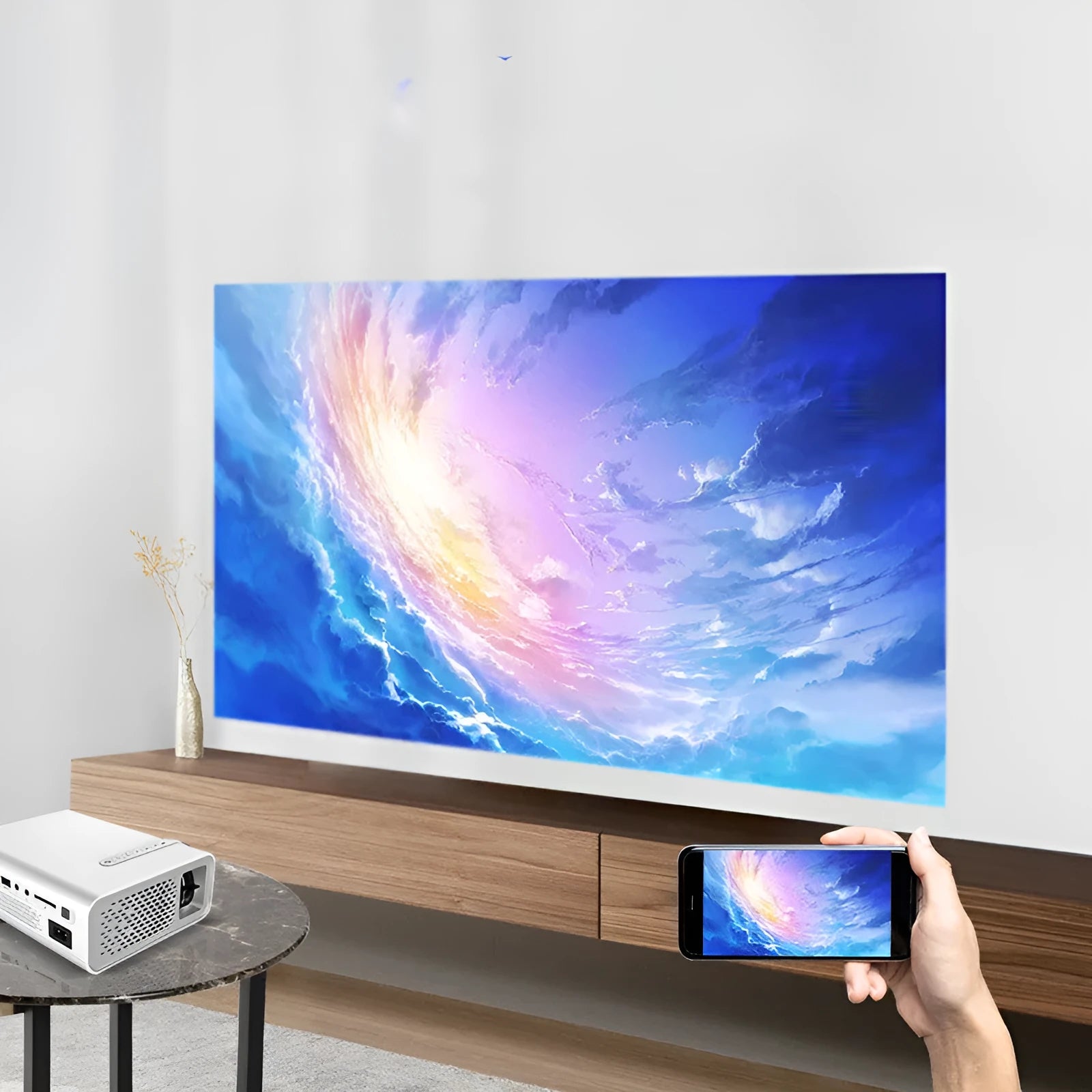 YG530 mini mobile phone projector in black or white projecting a large wireless screen image up to 138 inches