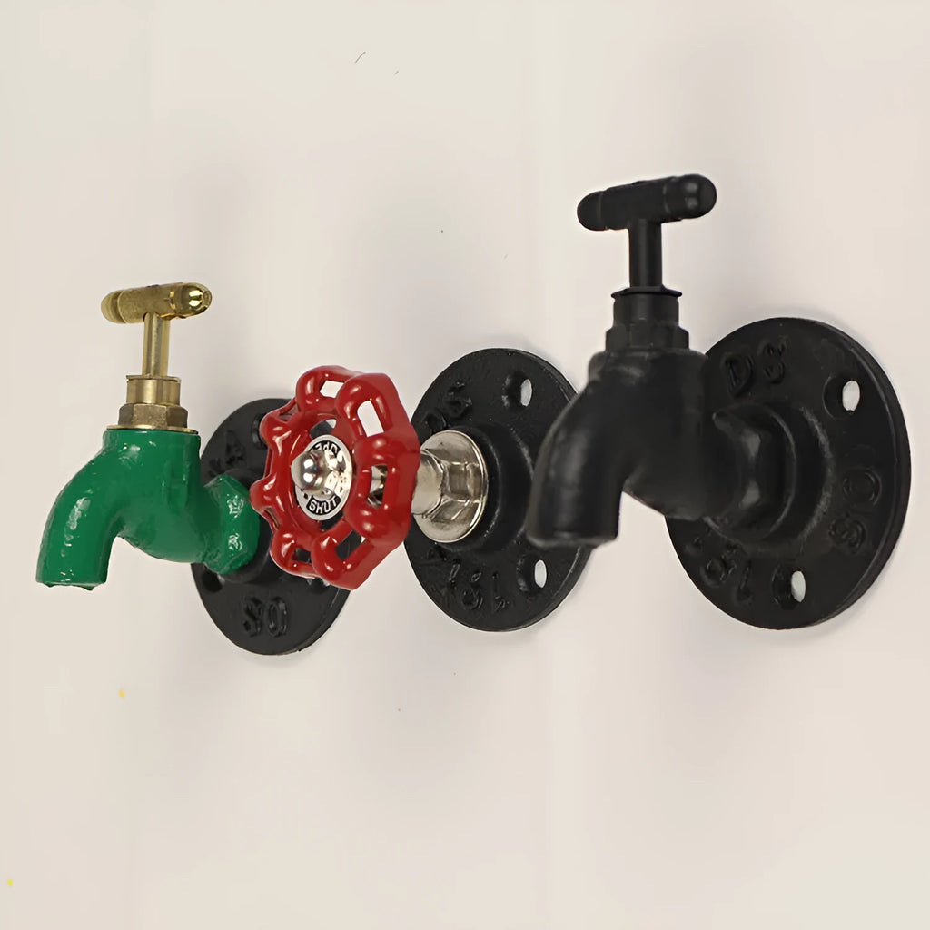 A polished metal wall hook in a water pipe design, shown in black, green, and red colour options.