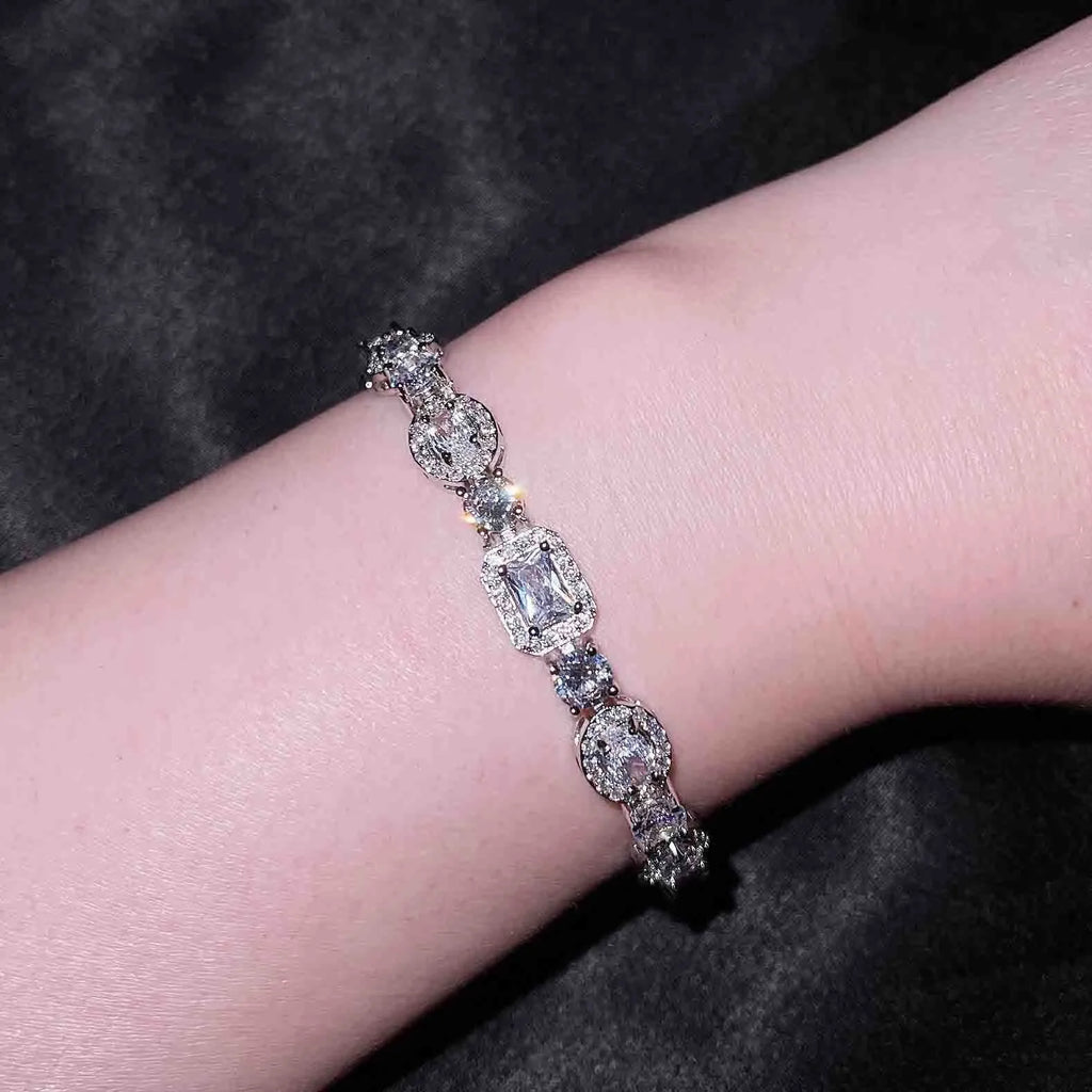 Women's geometric silver-plated bracelet with zircon stones showing adjustable and fixed length options
