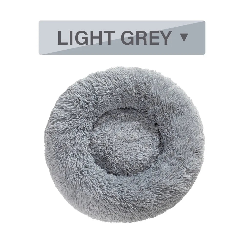 Donut-shaped long plush pet bed with raised sides, shown in a neutral colour.