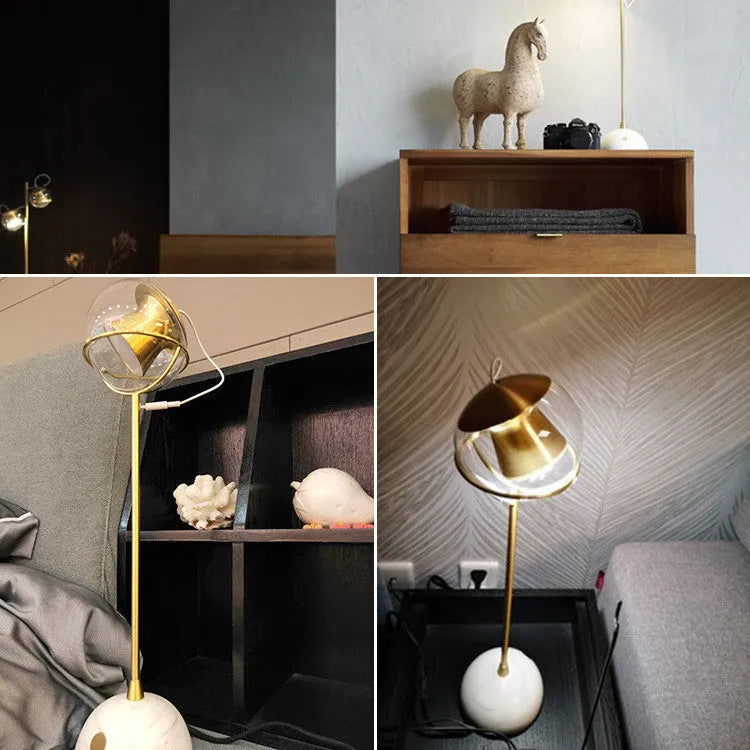 White desk lamp with glass shade and touch-sensitive dimmer switch.