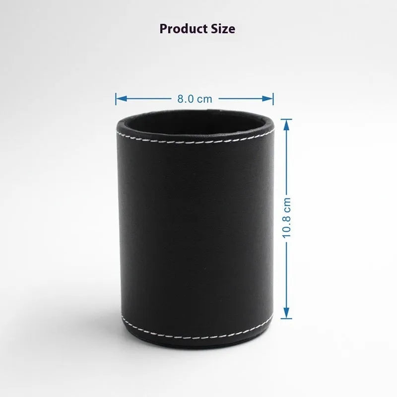Round black leather pen holder on a desk