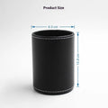 Round black leather pen holder on a desk