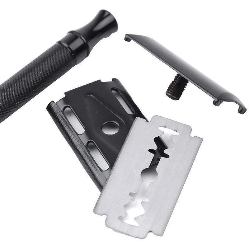 Traditional manual pogonotomy scraper and brush set for wet shaving in black or silver metal finish.