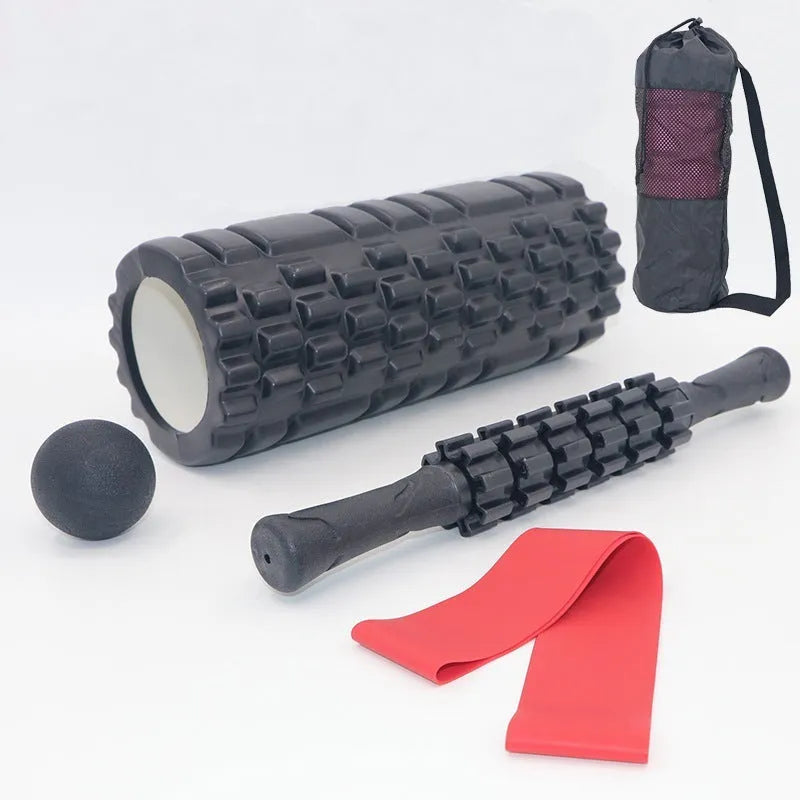 Black 33cm fitness foam roller with six gear massage bar pieces on grey background