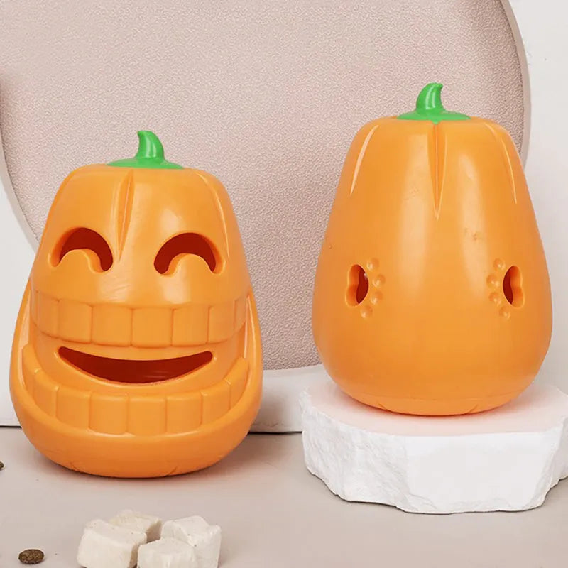 Orange Halloween pumpkin shaped rubber dog toy with a treat-dispensing funnel.