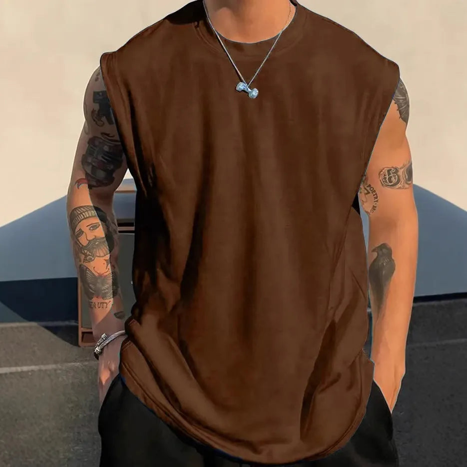 Men's loose cotton tank top in dark grey showing straight hem design and sleeveless construction