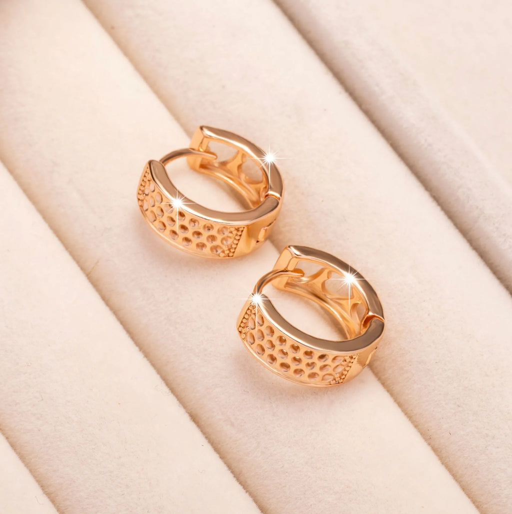 Rose gold electroplated earrings with three hollow heart shapes in circular arrangement