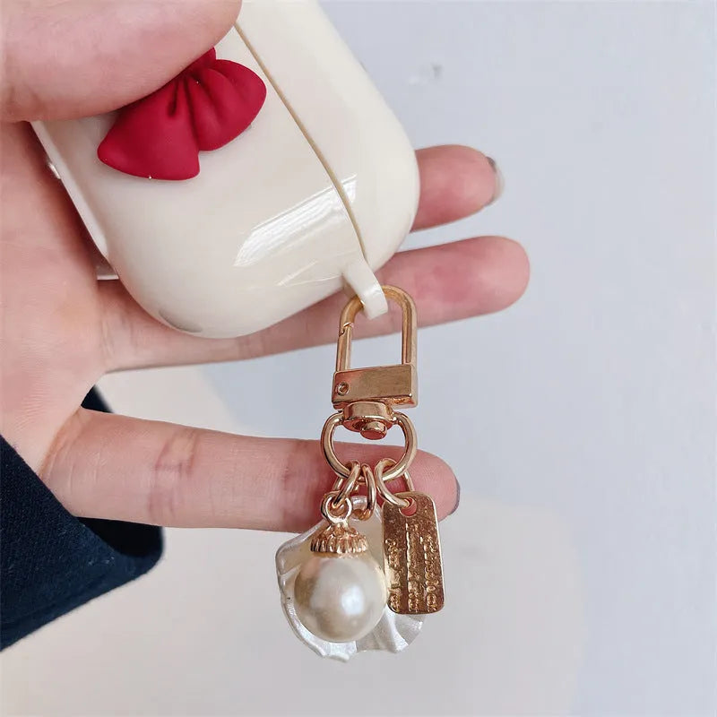 Beige red bow shell wireless earphone case for AirPods with clamshell design