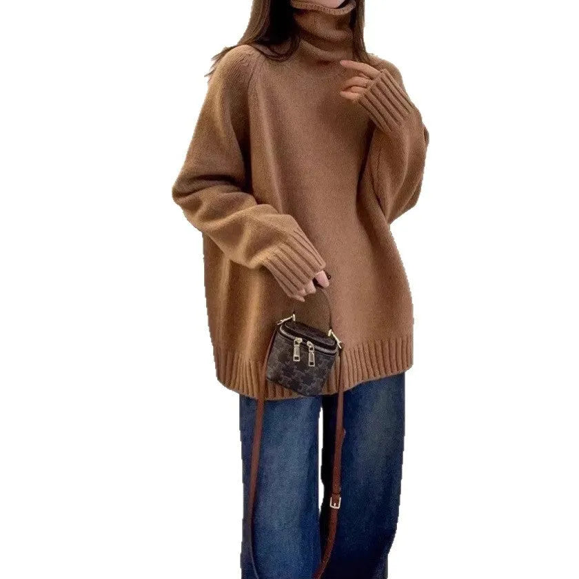 Women's loose-fit turtleneck sweater with a thick, textured curling pile collar in a grey solid colour.