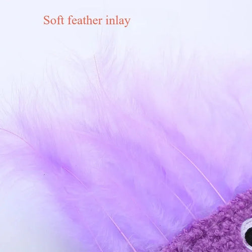 Colourful cat plush toy with a big mouth explosion head shape on a plain background.