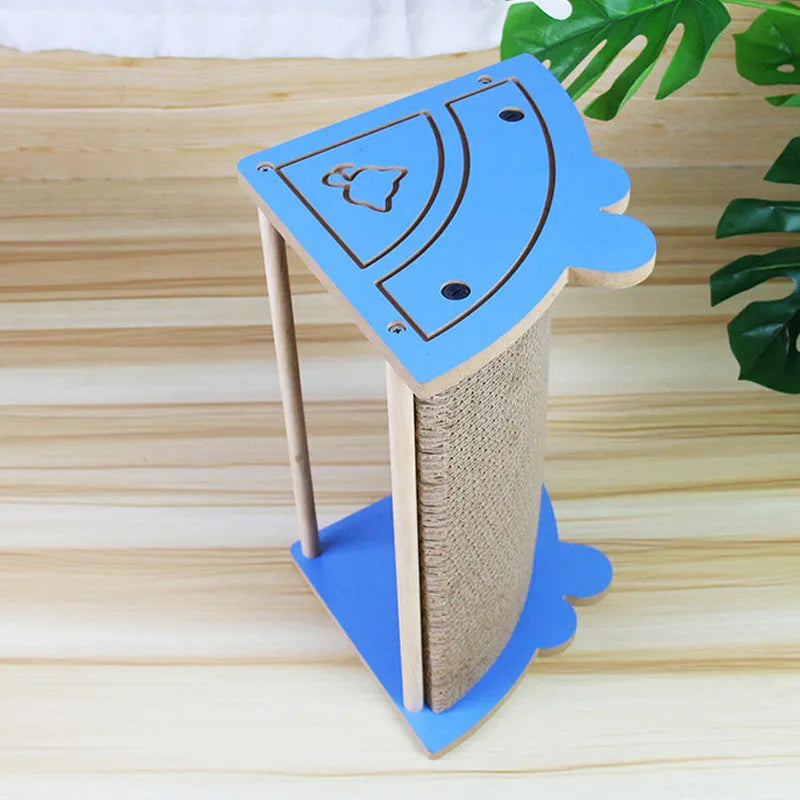 Cardboard corner scratching pad for cats on a wall with hanging ball and catnip.