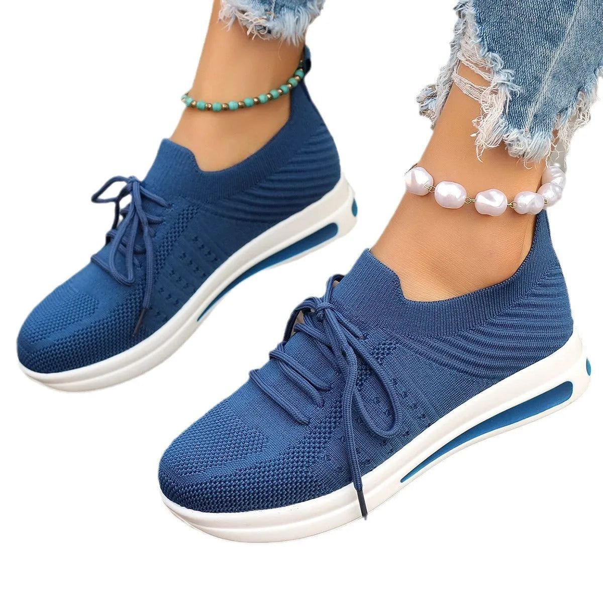 Women's fly-knit casual sneakers in black blue and red with artificial PU upper and low top design