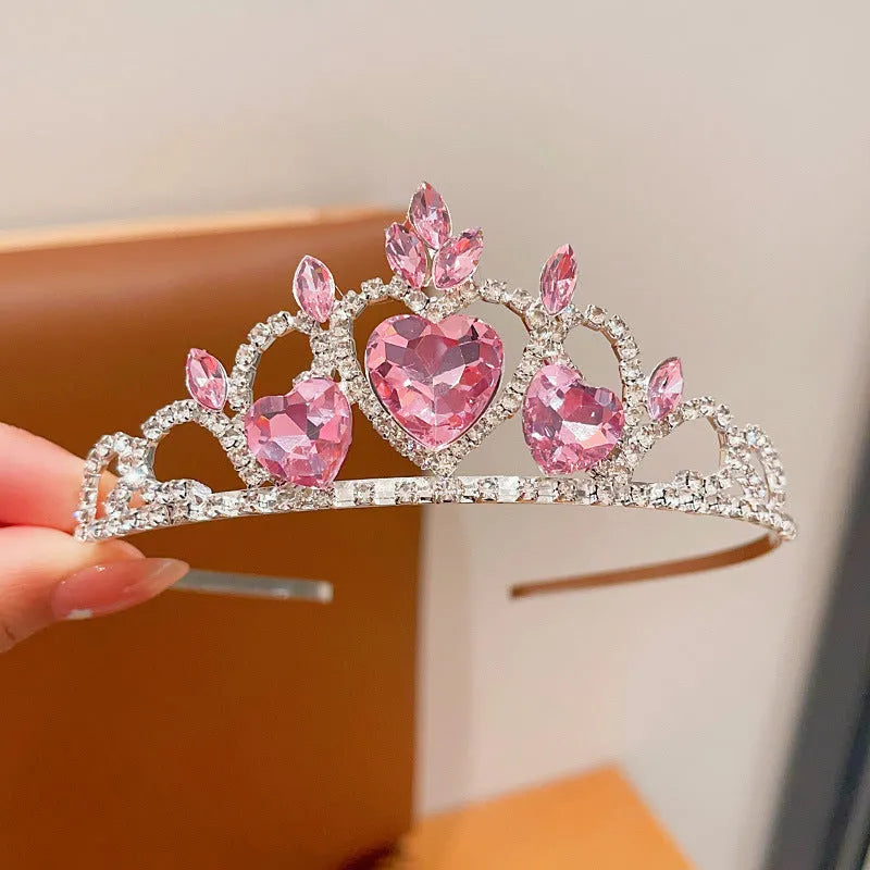 Children's metal alloy crown headdress hairband in pink, light blue, or light purple with crystal decoration.