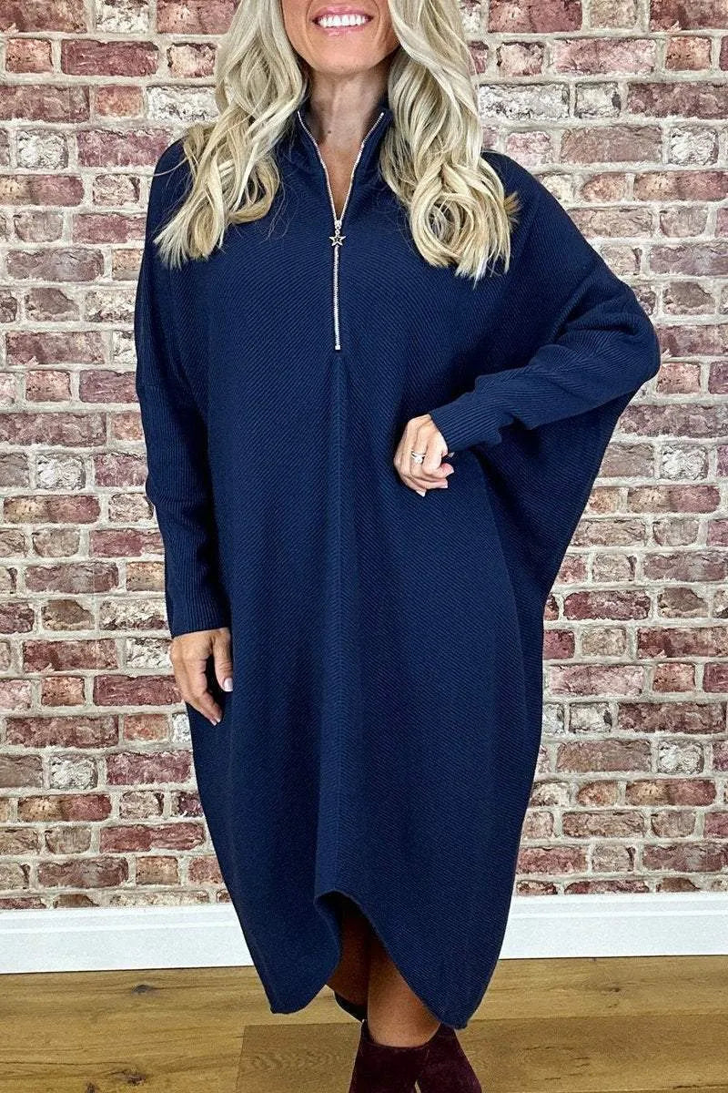 Women's loose-fit knitted dress in navy blue with a front zip closure and raglan sleeves.