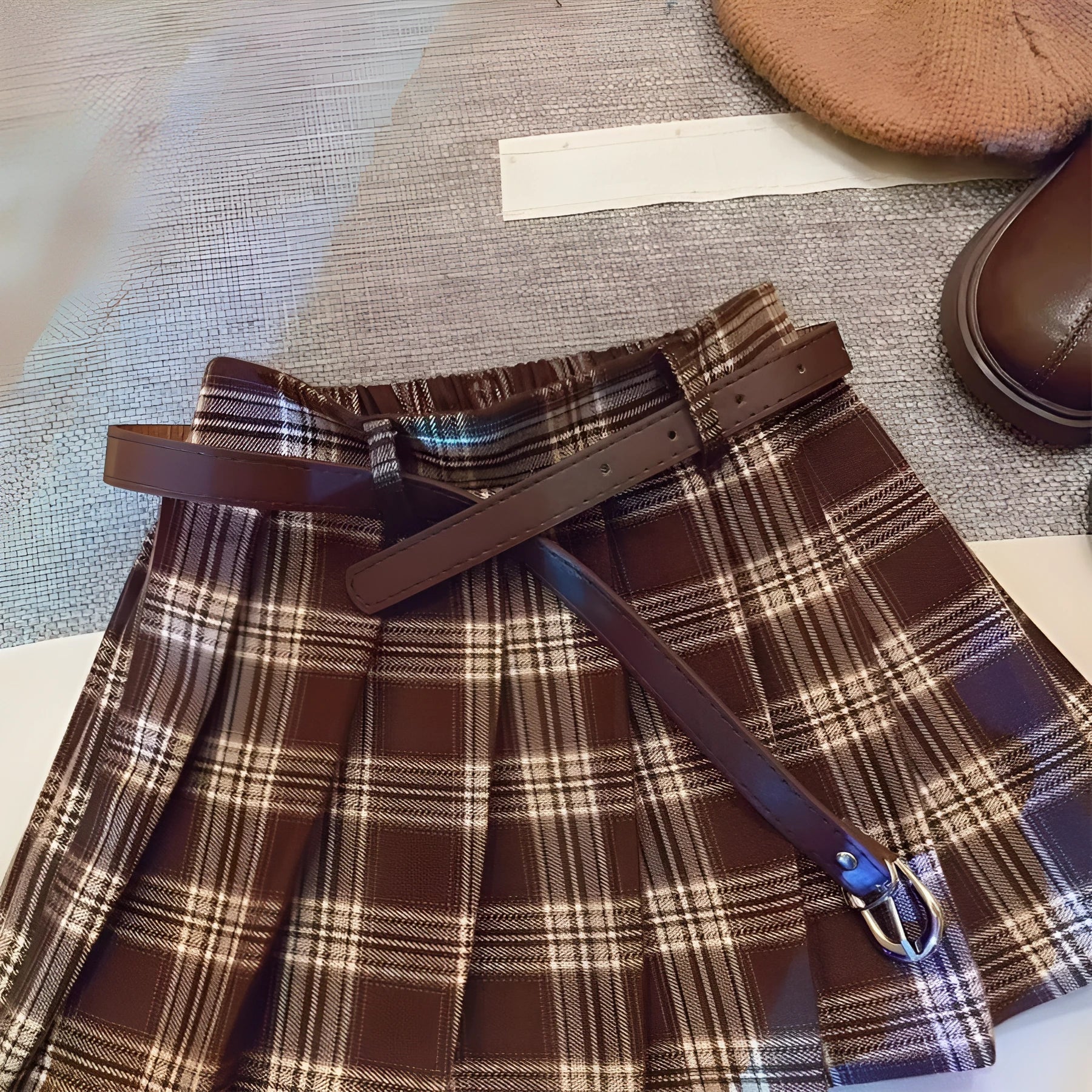 Girls' plaid pleated A-line skirt made from cotton blend fabric with a full lining.