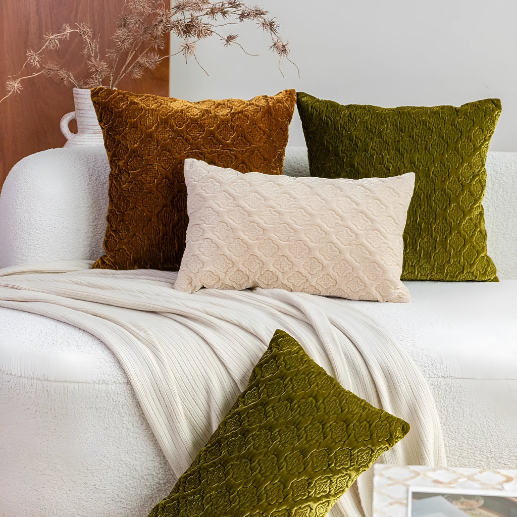 Brown gold antique-style three-dimensional quilted cushion pillow on a sofa