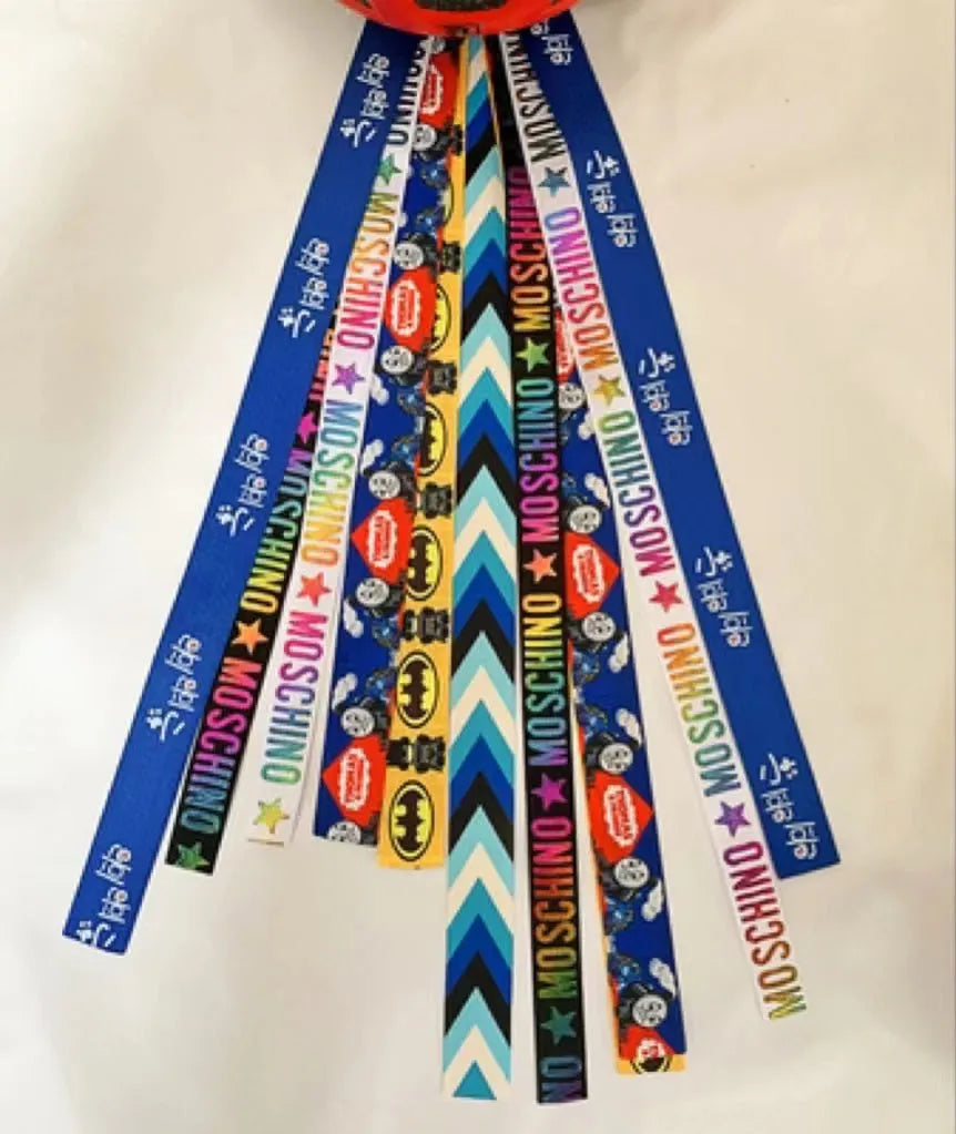 Children's decorative helmet streamer ribbon in multiple colours for roller skating and skiing safety gear.