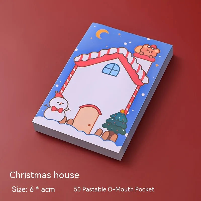 Christmas sticky notes book showing cartoon designs of Elf, Gift, Sled, Ball, Santa, House, Bear, and Snowman