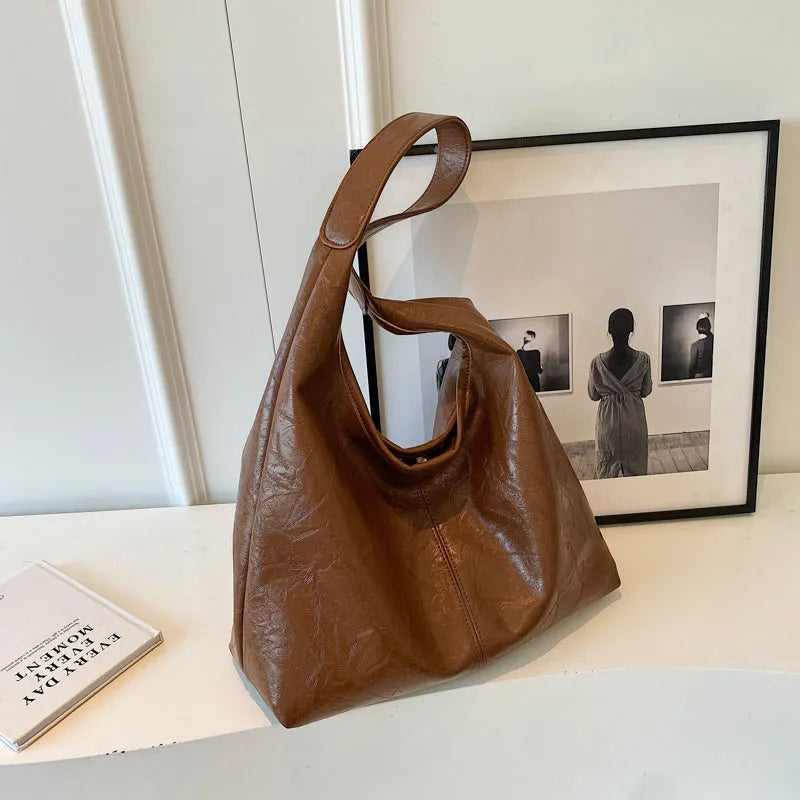 Casual soft leather shoulder bag with sandwich pockets in various colour options
