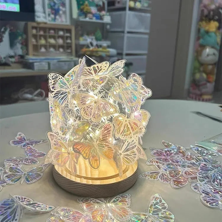 Butterfly-themed small night lamp with glass shade and raw wood base, 12x15 cm.