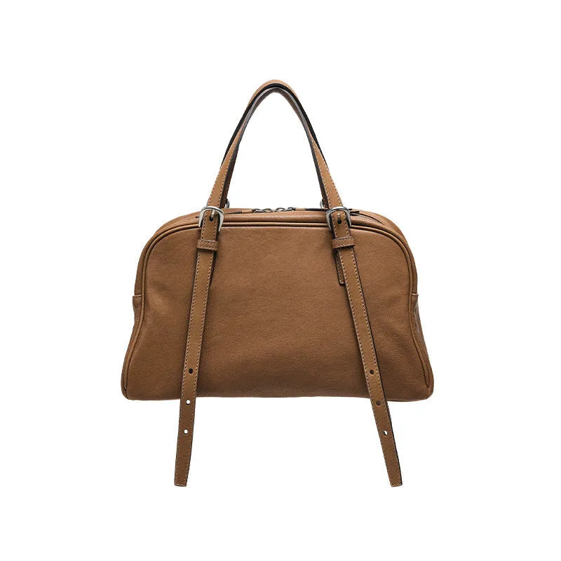 Women's black genuine leather retro shoulder bag showing horizontal square shape and double shoulder straps