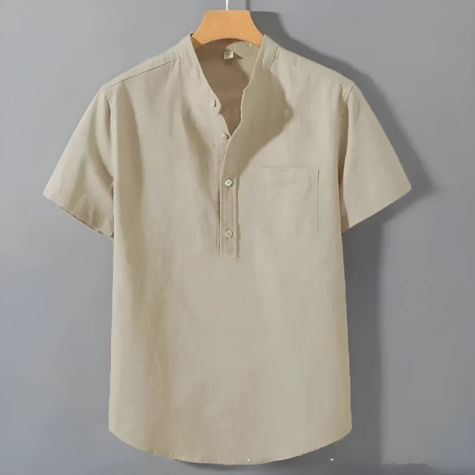Men's casual beige linen short sleeve shirt with a stand collar and loose fit on a hanger.