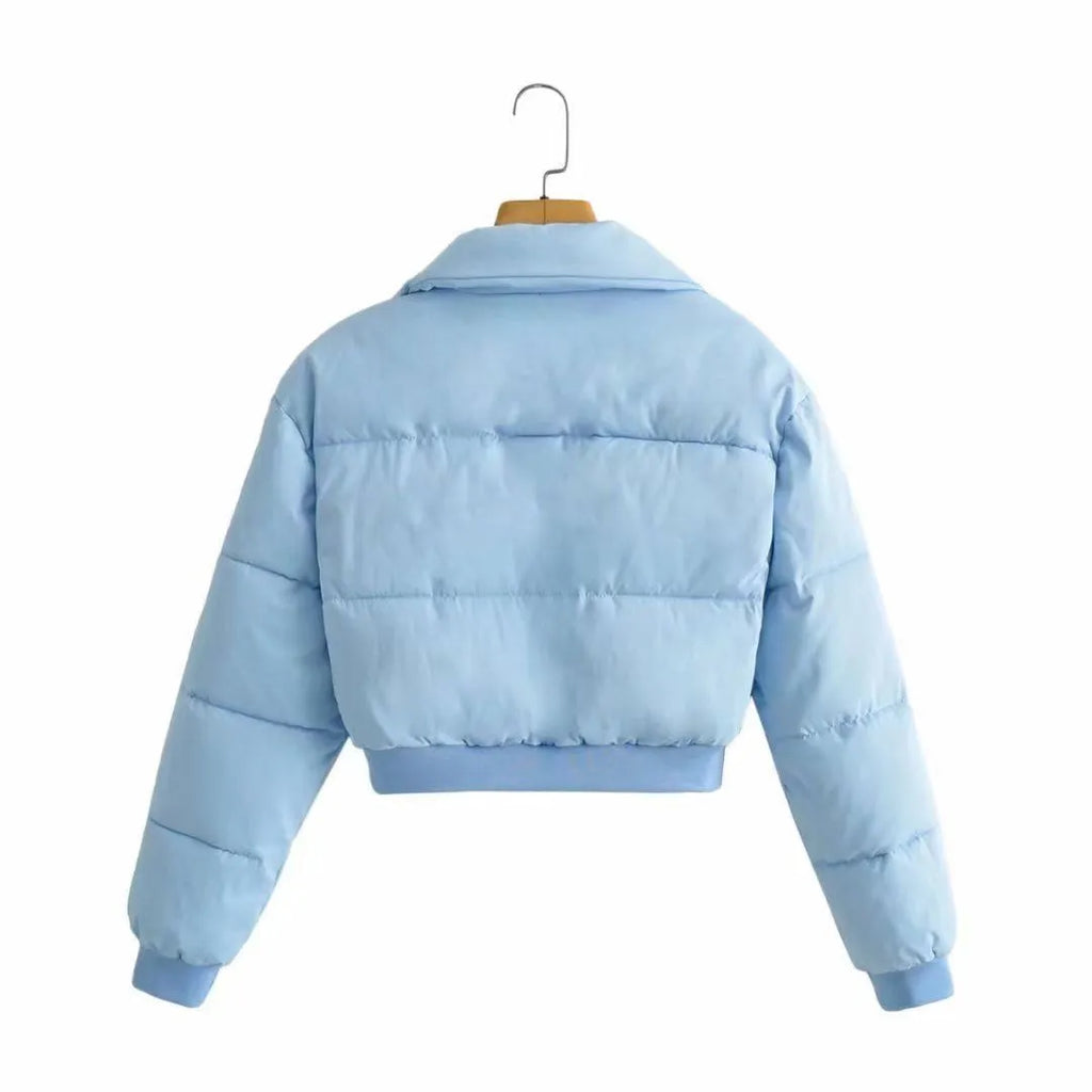 Women's loose blue polyester jacket with regular long sleeves showing front view