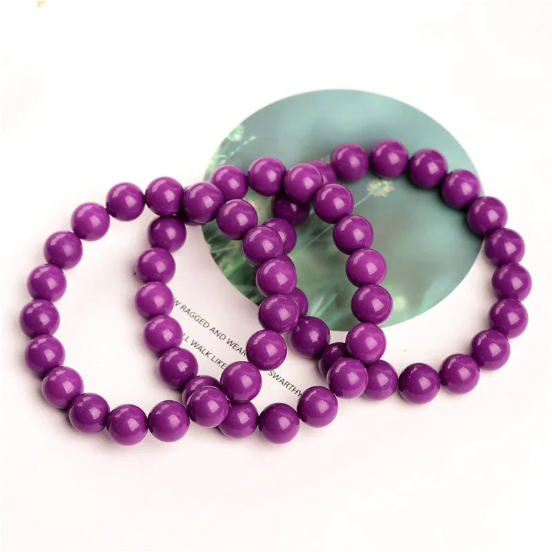Jiuya original design purple mica crystal bracelet on a wrist, showing polished beads in a single circle.