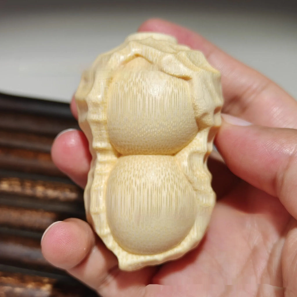 Solid bamboo peanut ornament carving with May Good Things Happen message