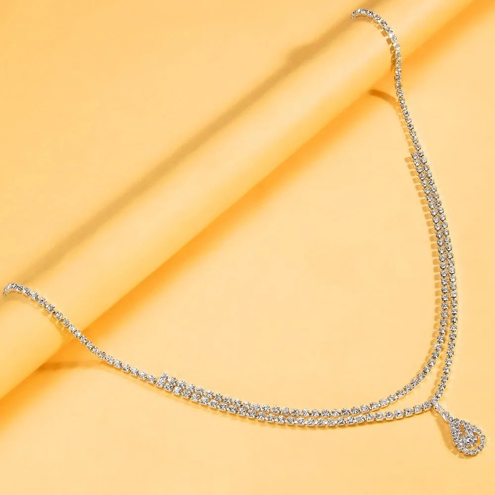 Gold or silver waist chain for women with water drop pendant and tassel detailing
