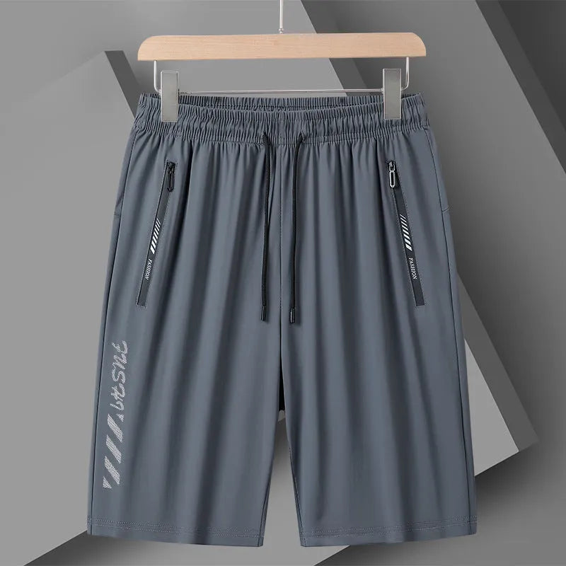 Man wearing black loose-fit quick-drying nylon sports shorts for summer.
