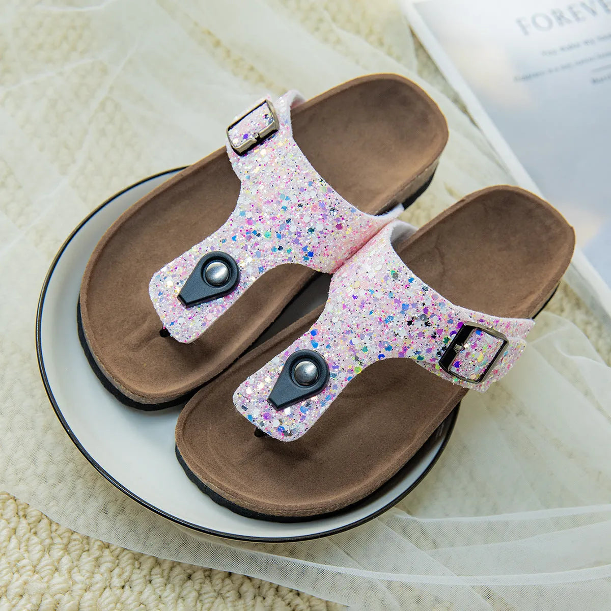 Gold frosted cork flip-flop slippers with hollow-out design and non-slip PVC sole.