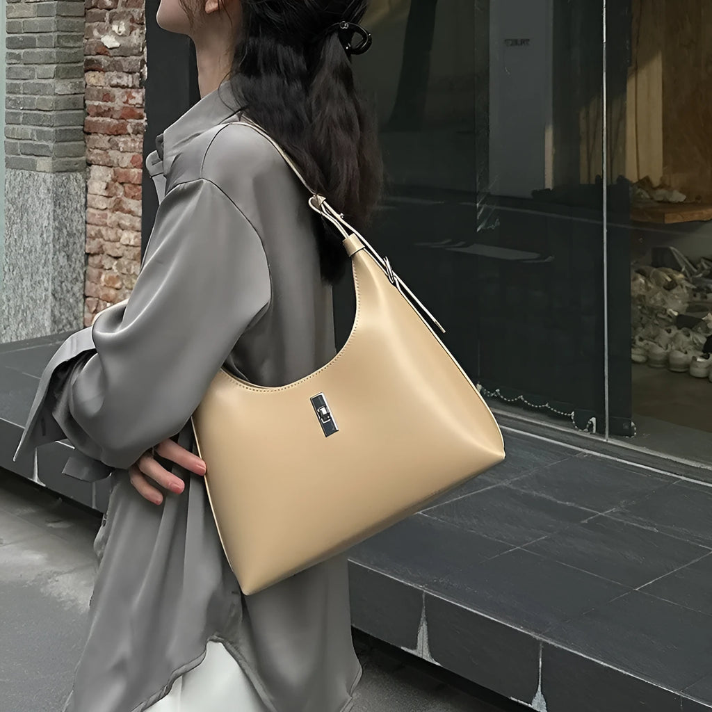 Genuine leather dumpling-shaped crossbody bag with multiple compartments in apricot colour