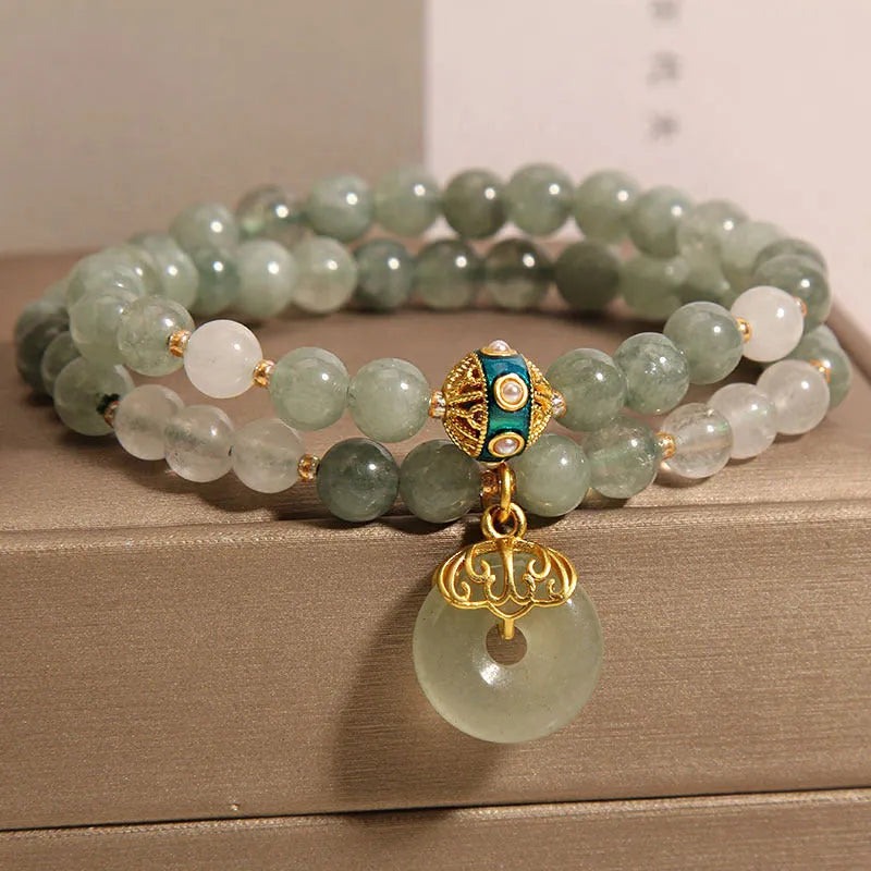 Women's double-layer crystal bracelet with peace buckle in oil emerald colour and rhinestone detailing