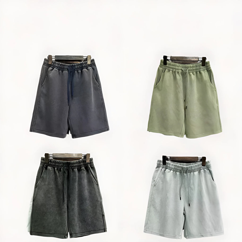 Men's loose-fit cotton casual shorts in distressed style, shown in charcoal black.