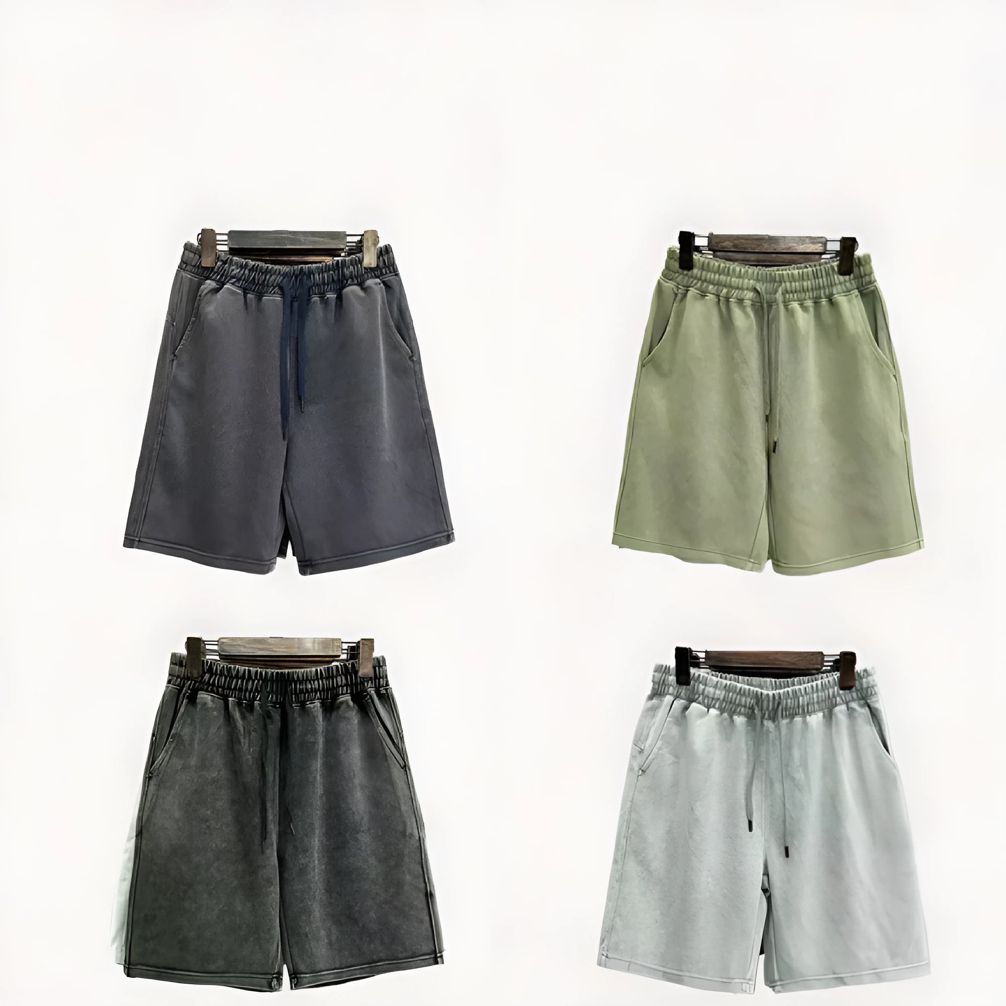 Men's loose-fit cotton casual shorts in distressed style, shown in charcoal black.