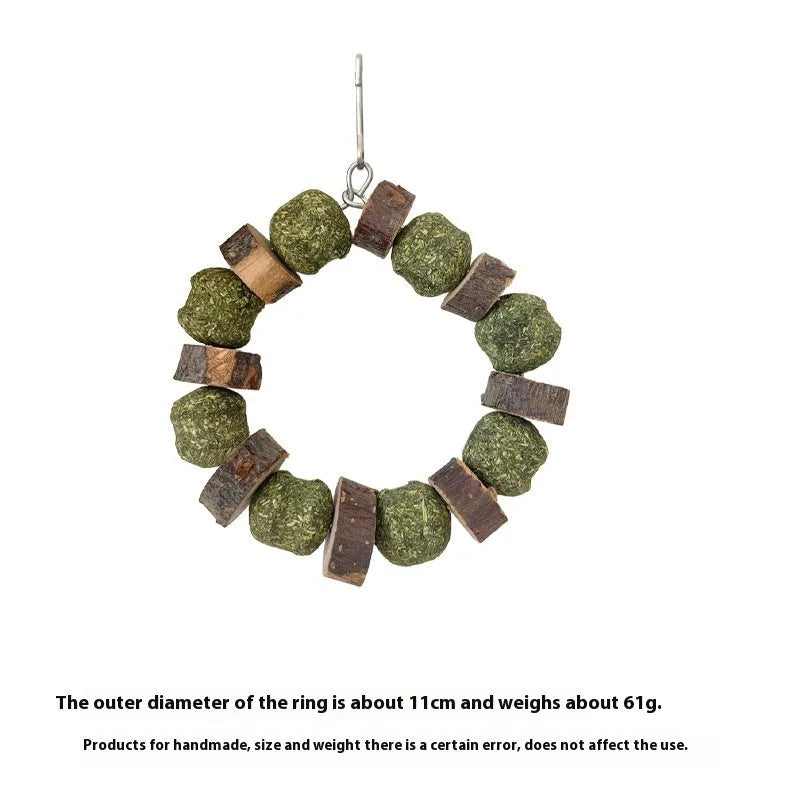 Applewood and straw ball ring chew toy for hamsters, guinea pigs, and rabbits on a white background.