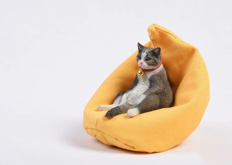 Lazy cat resin car dashboard ornament with sofa, 7.5cm tall