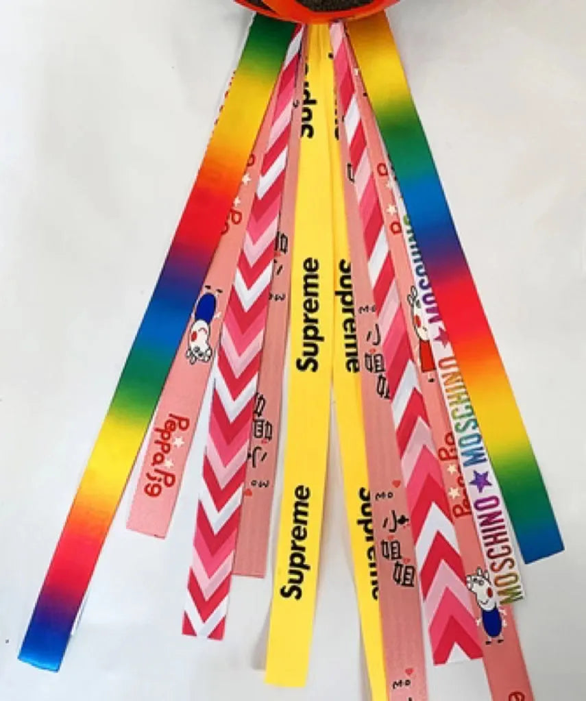 Children's decorative helmet streamer ribbon in multiple colours for roller skating and skiing safety gear.
