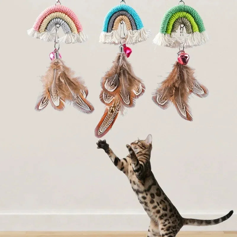 Blue feather cat rope toy hanging from a door with elastic swing and sticky buckle clamp